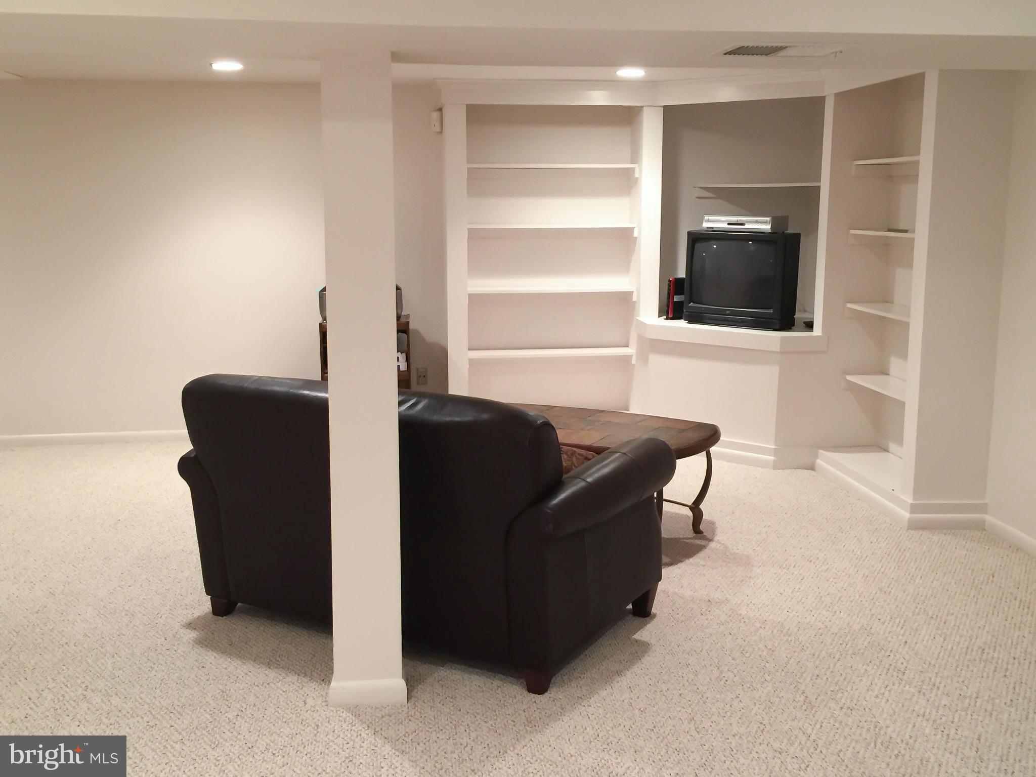 11423 Running Cedar Road Reston, VA 20191 - Photo 26 of 28 a living room with furniture and a flat screen tv