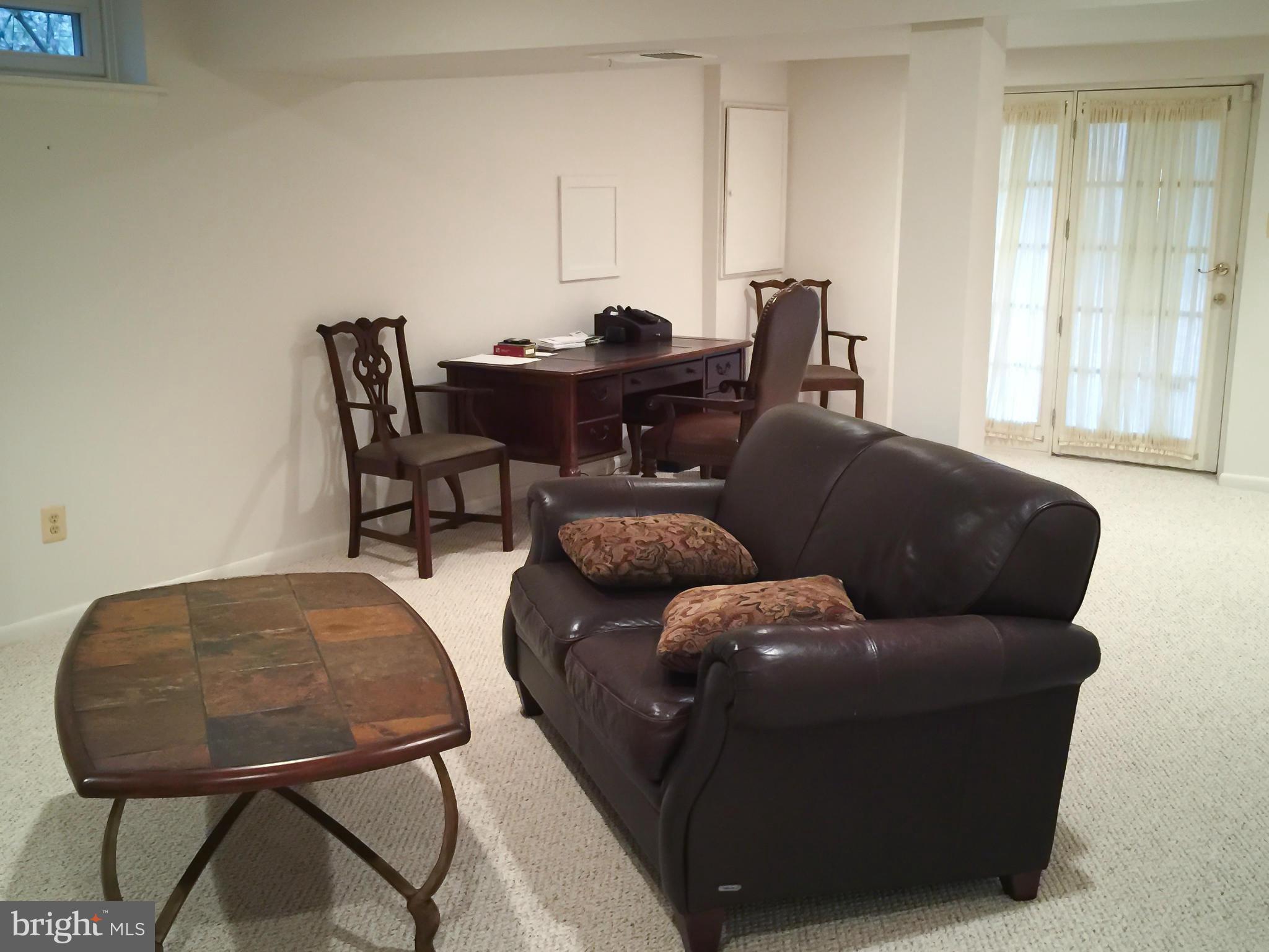 11423 Running Cedar Road Reston, VA 20191 - Photo 27 of 28 a living room with furniture and a window