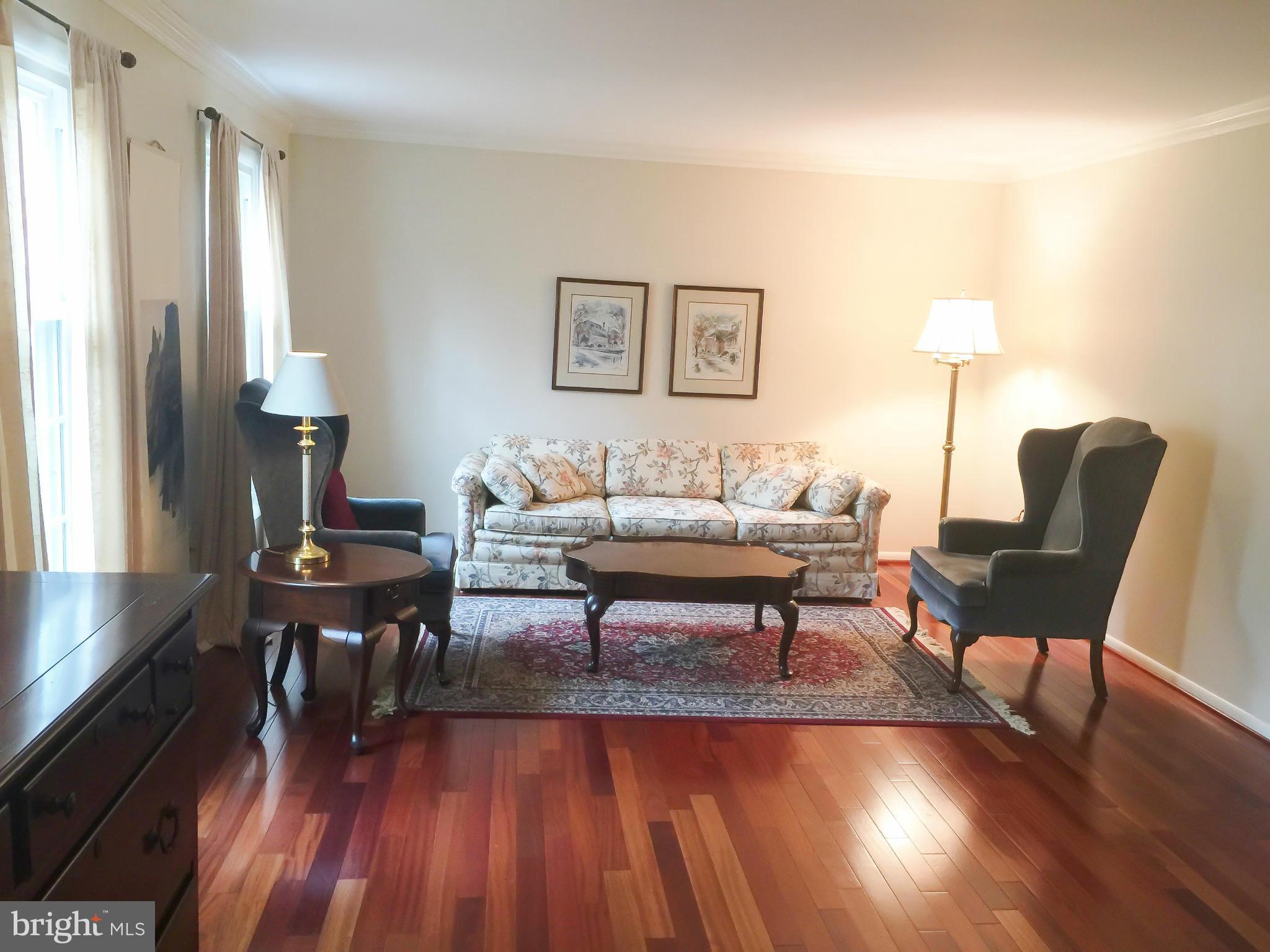 11423 Running Cedar Road Reston, VA 20191 - Photo 4 of 28 a living room with furniture and a wooden floor