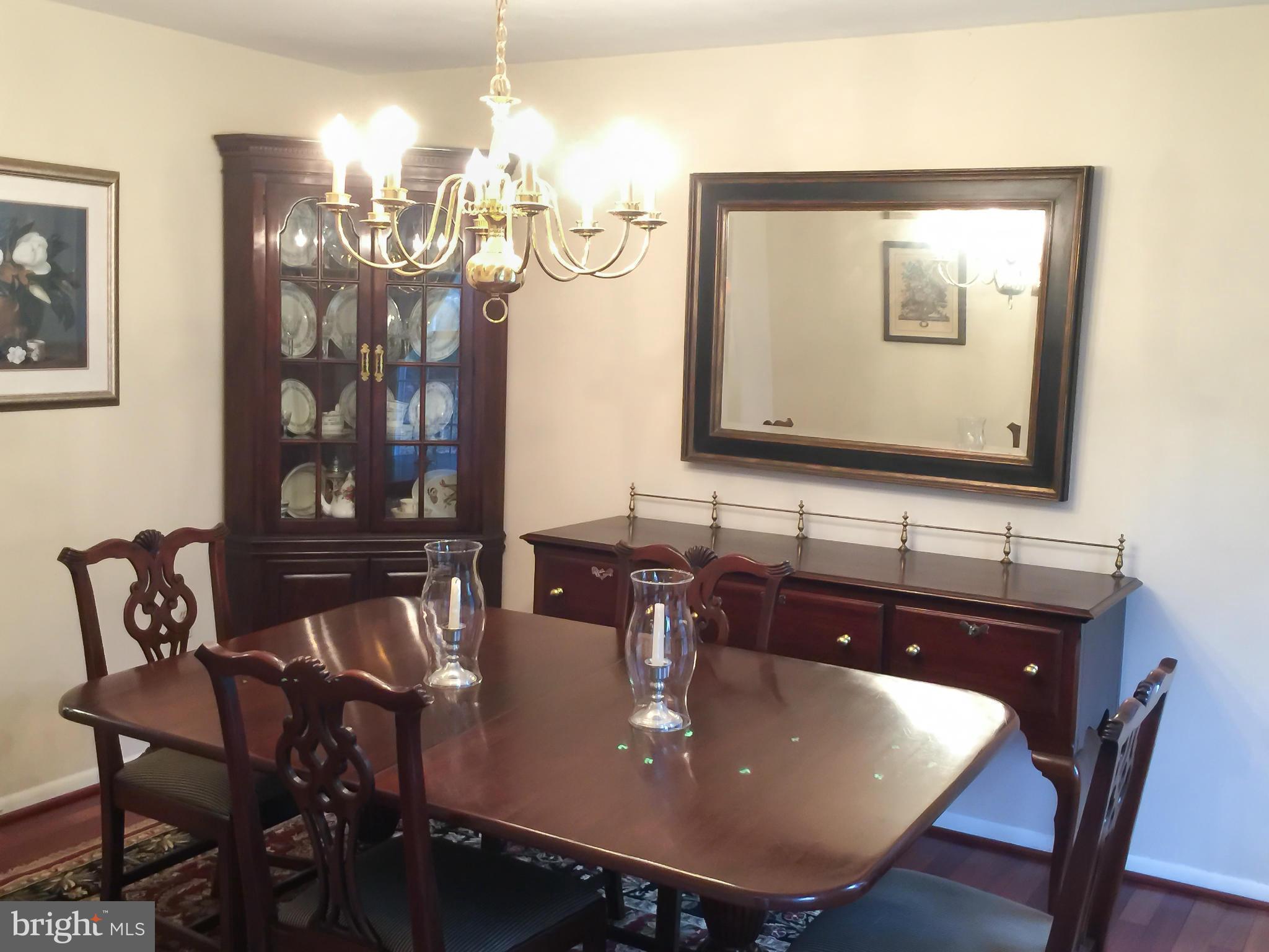 11423 Running Cedar Road Reston, VA 20191 - Photo 5 of 28 a view of a dining room with furniture and chandelier