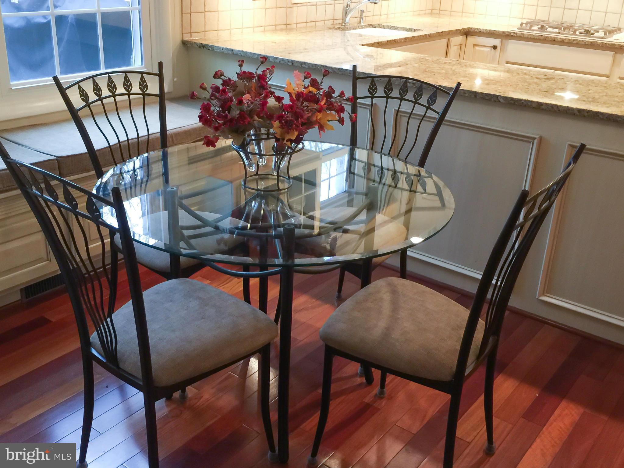 11423 Running Cedar Road Reston, VA 20191 - Photo 7 of 28 a view of a dining room with furniture and wooden floor