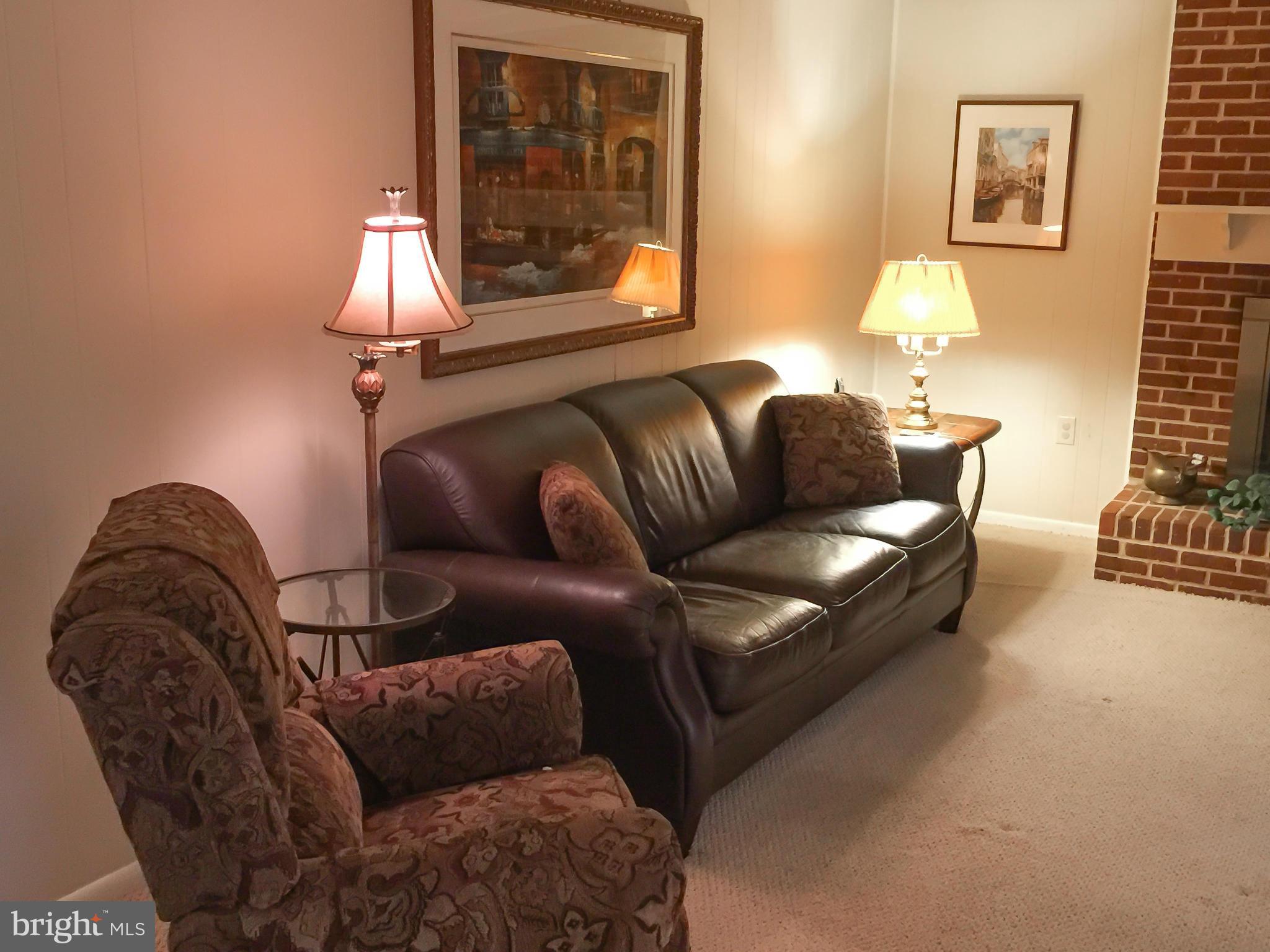 11423 Running Cedar Road Reston, VA 20191 - Photo 9 of 28 a living room with furniture and a fireplace