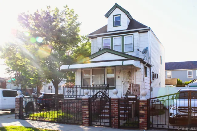a front view of a house with balcony and patio