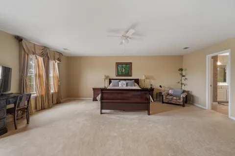 a bedroom with furniture and a window
