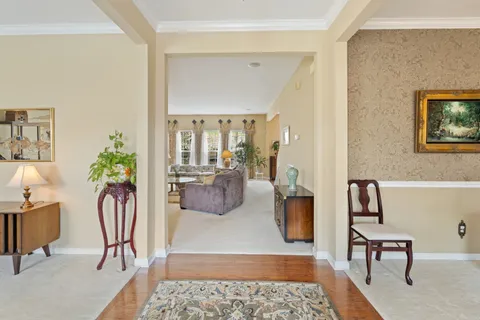 a living room with furniture rug and a table