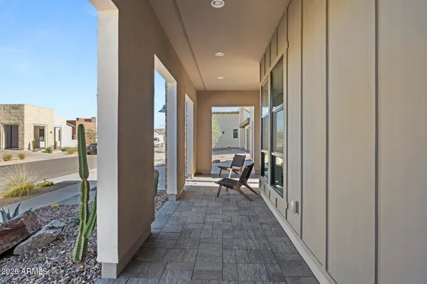 a kitchen with kitchen island a large counter top space a sink stainless steel appliances and cabinets