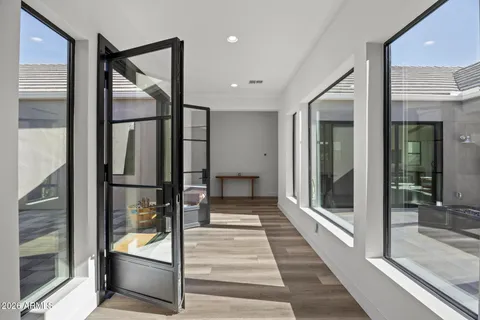 a large kitchen with a table and chairs