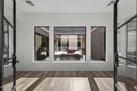 a living room with furniture and a large window