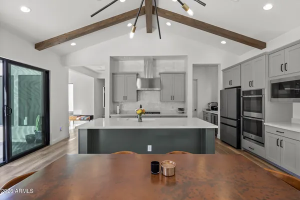 a view of room with furniture and wooden floor
