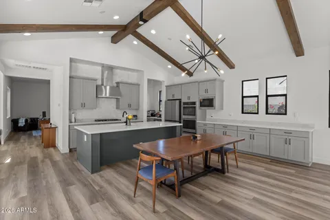 a bedroom with two beds and a large window