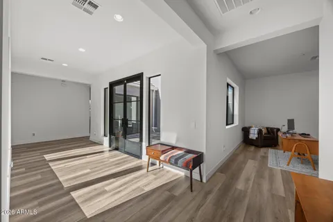 a bedroom with a bed and flat screen tv