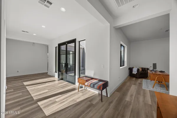 a bedroom with a bed and flat screen tv