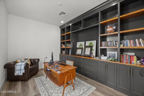 a spacious bedroom with a bed and a shower