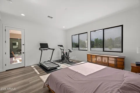 a view of a house with swimming pool and sitting area