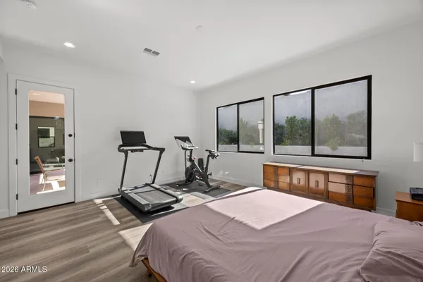 a view of a house with swimming pool and sitting area