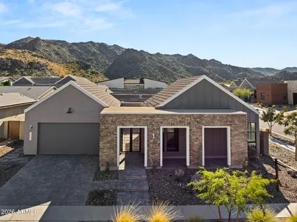 an aerial view of residential house and sandy dunes