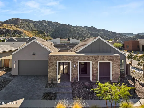 an aerial view of residential house and sandy dunes