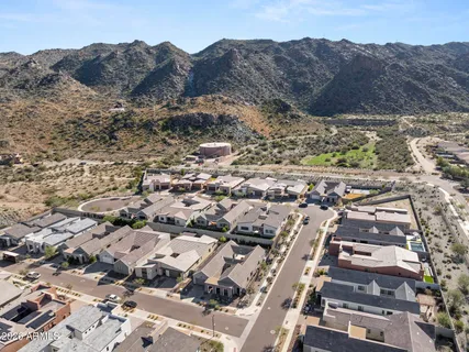 a front view of house with yard and trees around