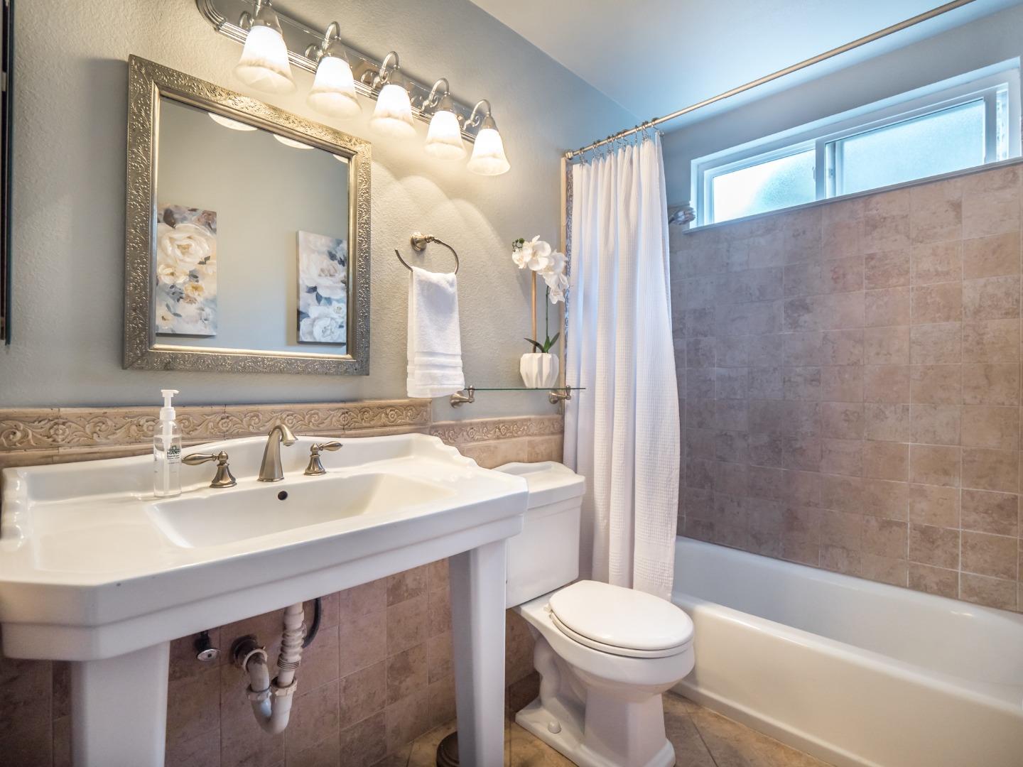 280 Marlin Court Aptos, CA 95003 - Photo 19 of 43 a bathroom with a sink a toilet and shower