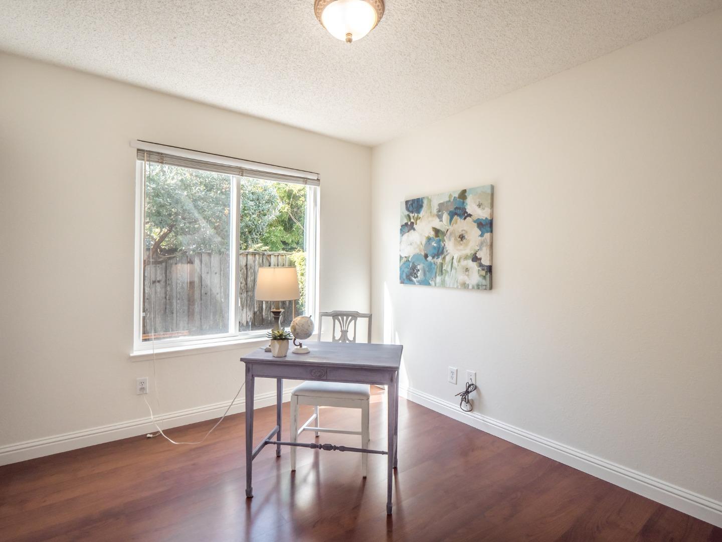280 Marlin Court Aptos, CA 95003 - Photo 20 of 43 a dining room with wooden floor and a table