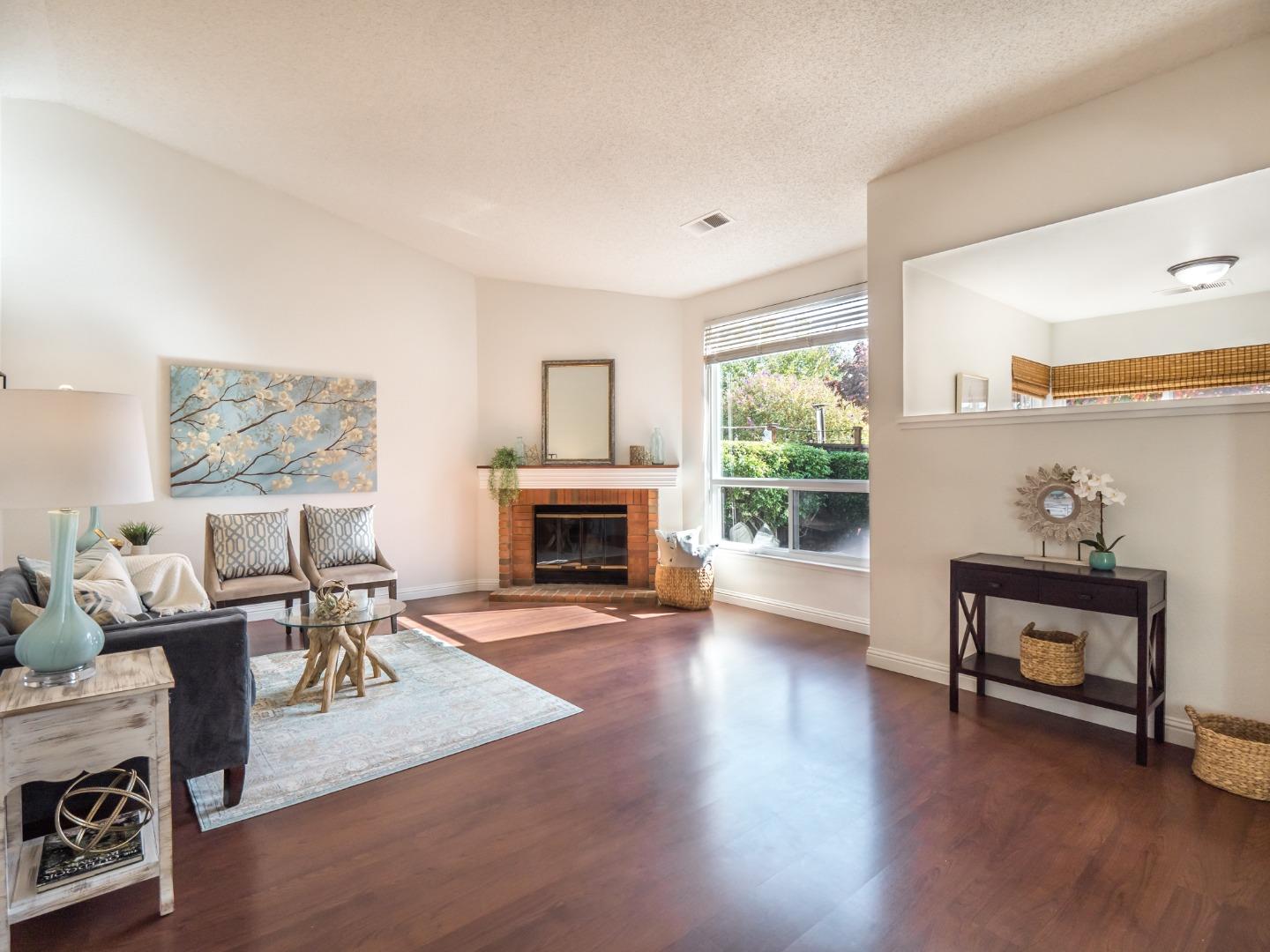280 Marlin Court Aptos, CA 95003 - Photo 3 of 43 a living room with furniture a fireplace and a large window