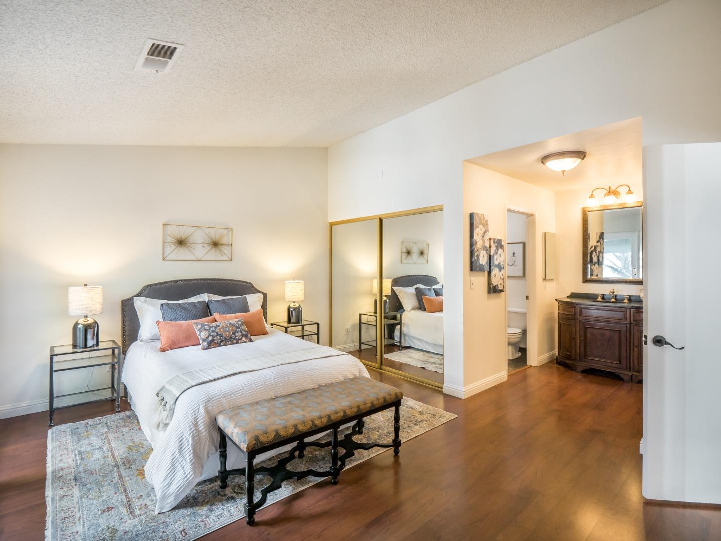 280 Marlin Court Aptos, CA 95003 - Photo 22 of 43 a bedroom with a bed and a view of living room