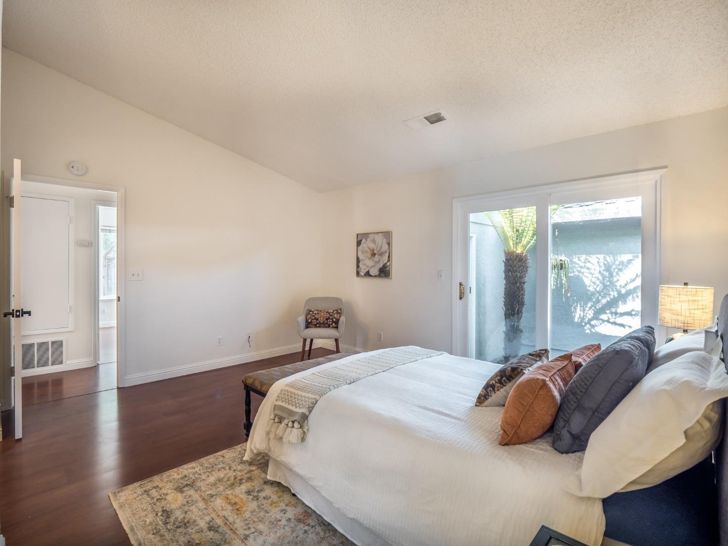 280 Marlin Court Aptos, CA 95003 - Photo 23 of 43 a bedroom with a bed and wooden floor
