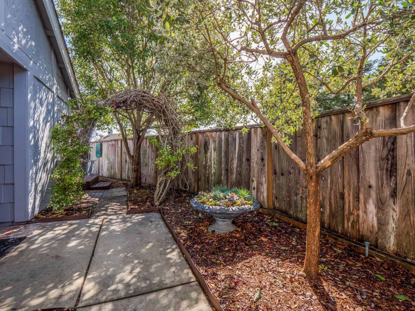 280 Marlin Court Aptos, CA 95003 - Photo 5 of 43 a backyard of a house with table and chairs