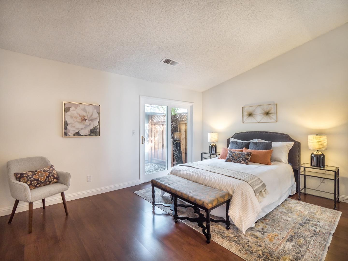 280 Marlin Court Aptos, CA 95003 - Photo 6 of 43 a bedroom with a bed and a lamp on table