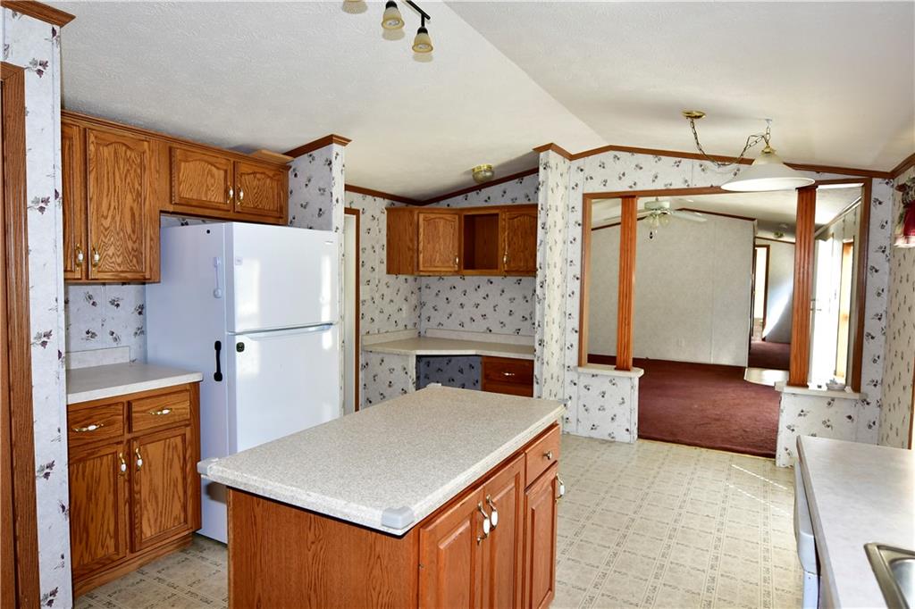 604 Deana Way Rochester, PA 15074 - Photo 17 of 22 a kitchen with a refrigerator and a sink