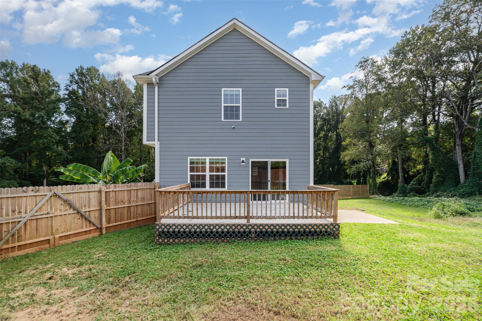 1003 Hunter Valley Road Shelby, NC 28150 - Photo 19 of 23 a view of a house with a yard and a wooden deck