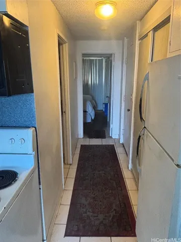 a view of a hallway view with staircase