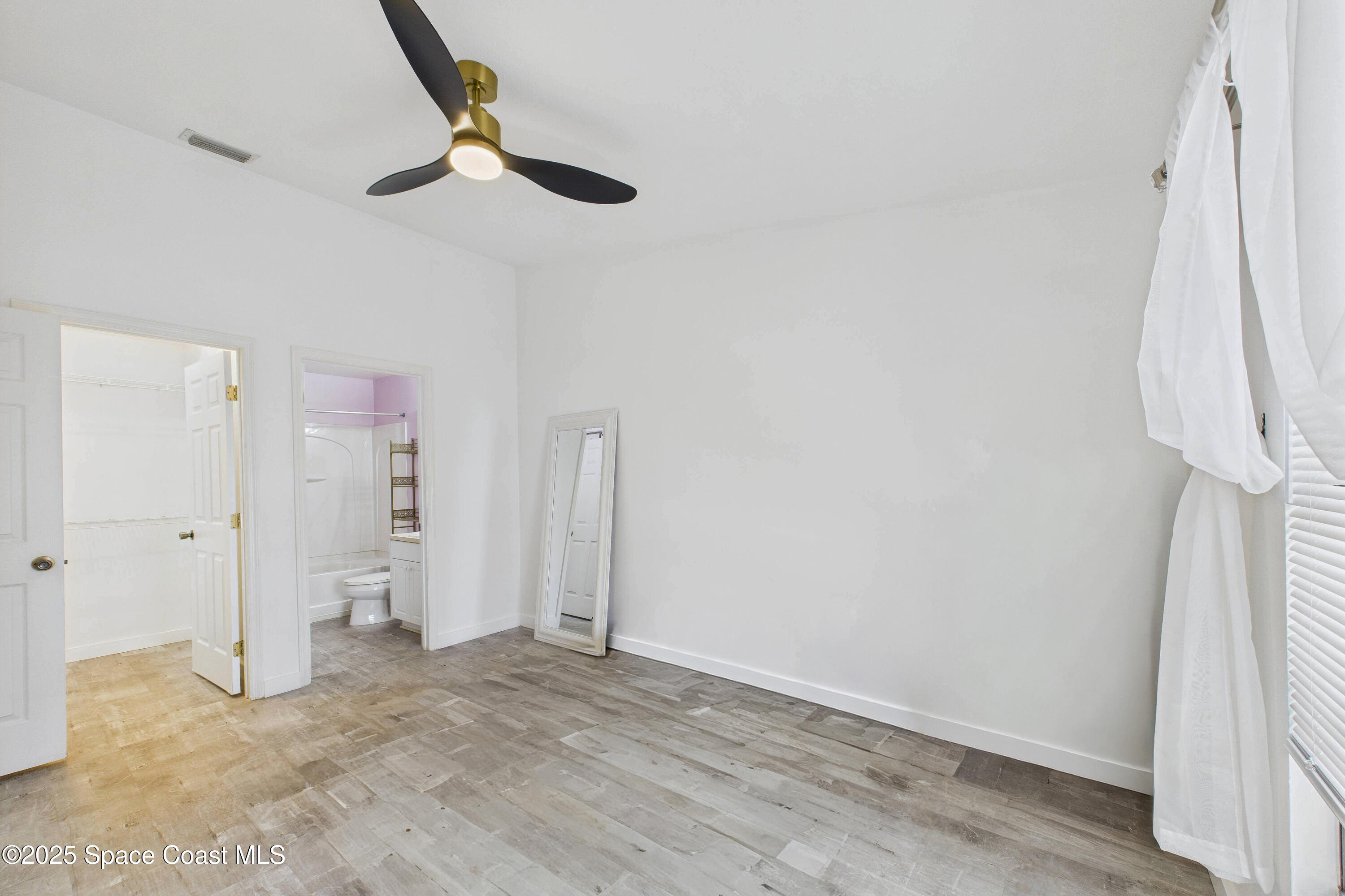 1010 Luminary Circle, Unit 104 Melbourne, FL 32901 - Photo 25 of 42 a view of empty room with ceiling fan