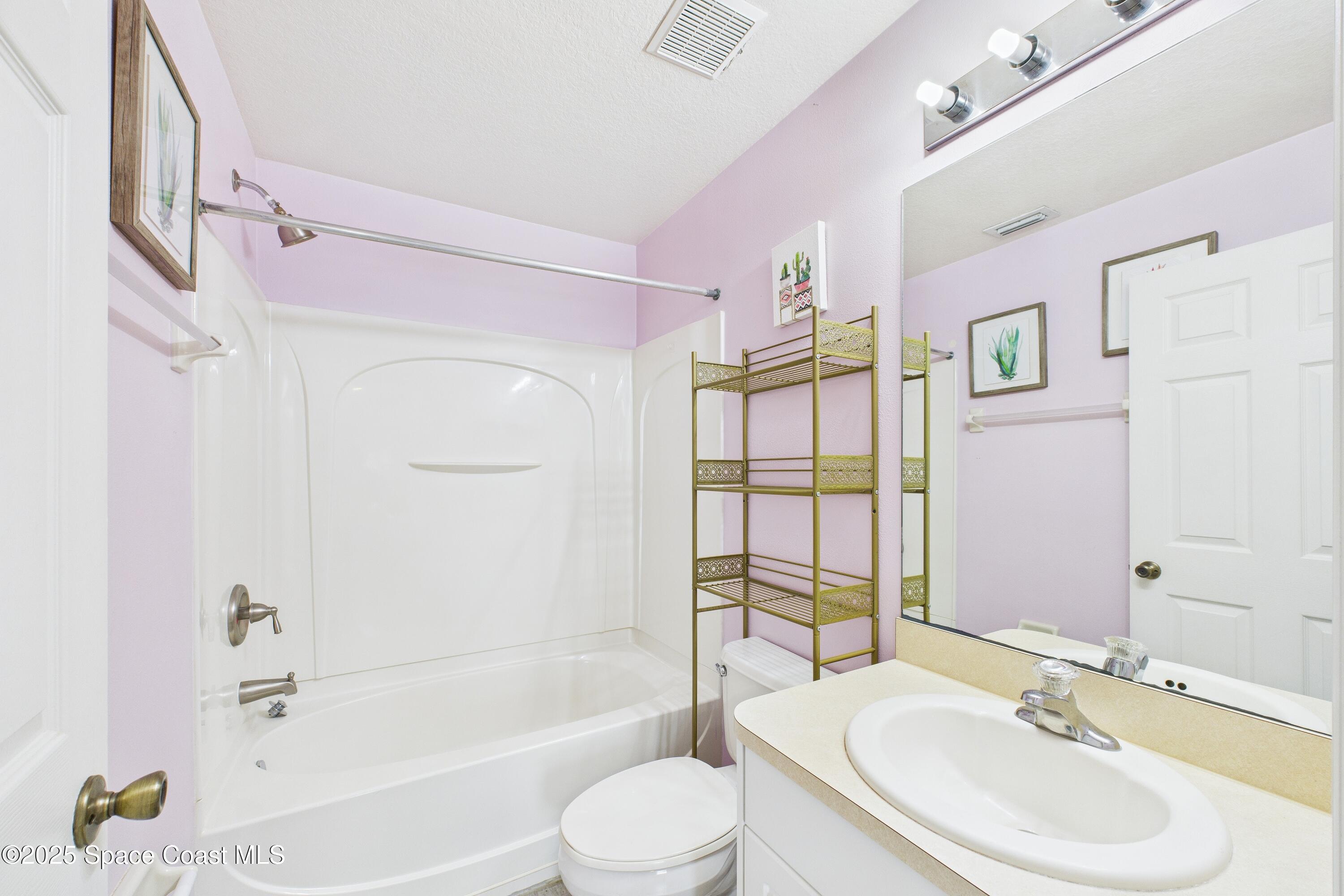 1010 Luminary Circle, Unit 104 Melbourne, FL 32901 - Photo 28 of 42 a bathroom with a sink toilet and shower