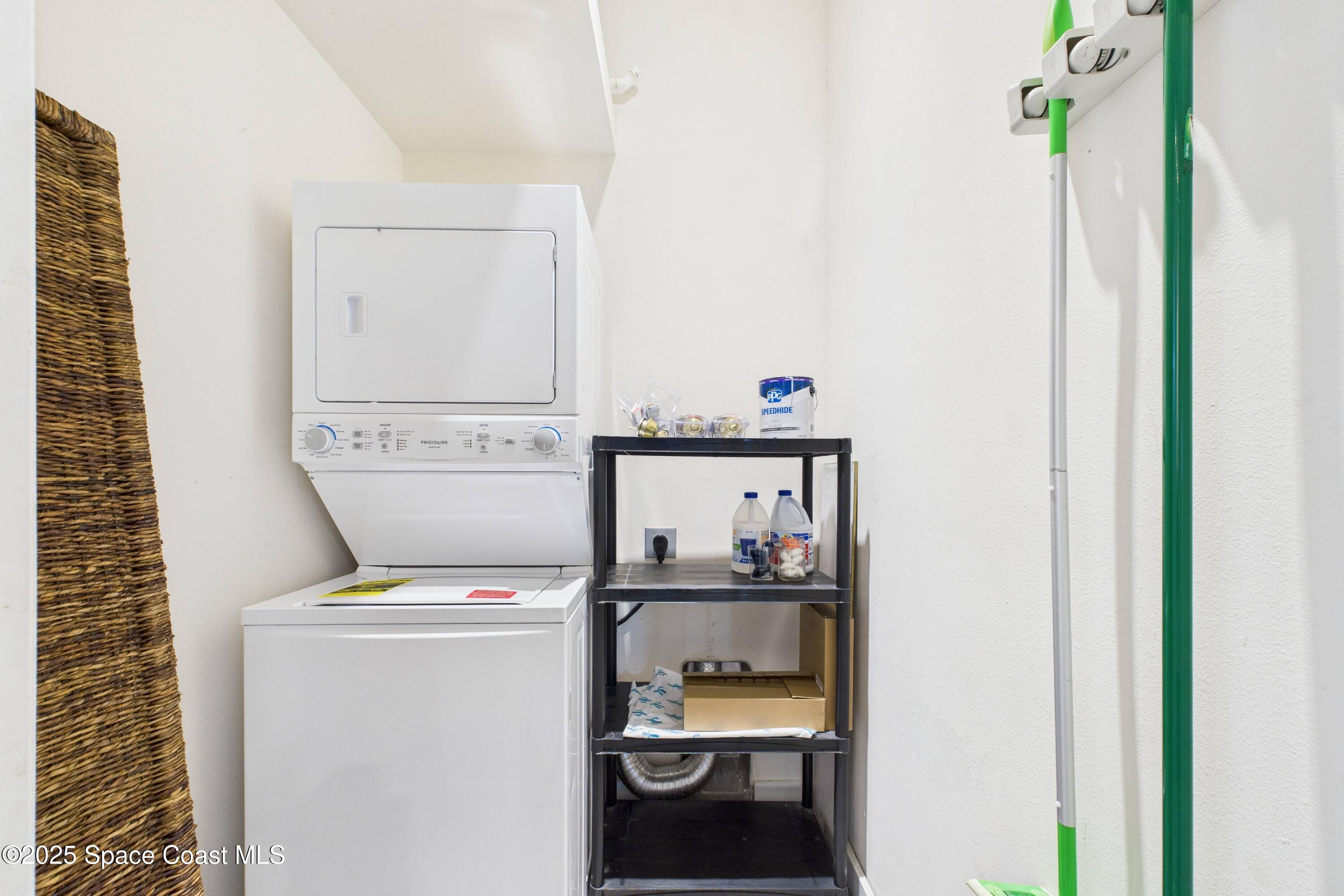 1010 Luminary Circle, Unit 104 Melbourne, FL 32901 - Photo 32 of 42 a utility room with dryer and washer