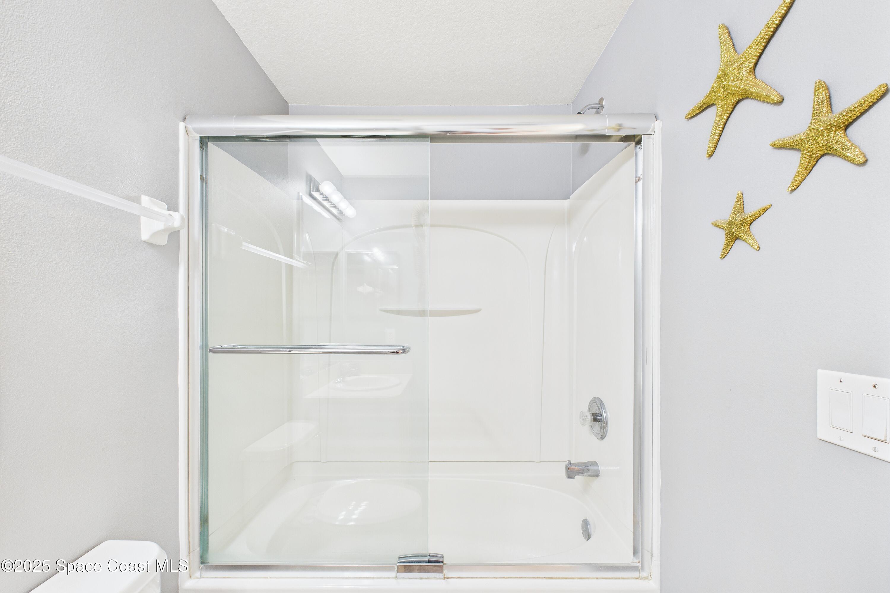 1010 Luminary Circle, Unit 104 Melbourne, FL 32901 - Photo 37 of 42 a bathroom with a shower