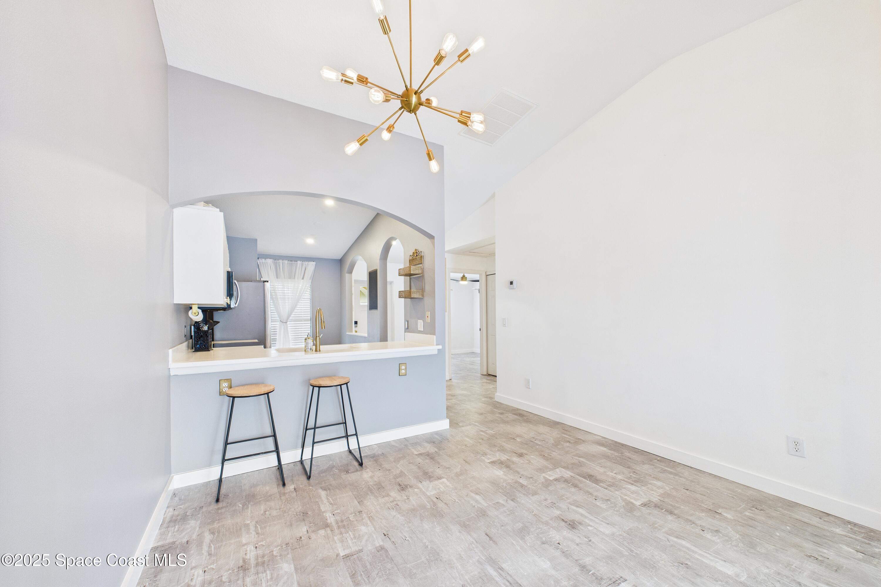 1010 Luminary Circle, Unit 104 Melbourne, FL 32901 - Photo 7 of 42 a view of a workspace with furniture