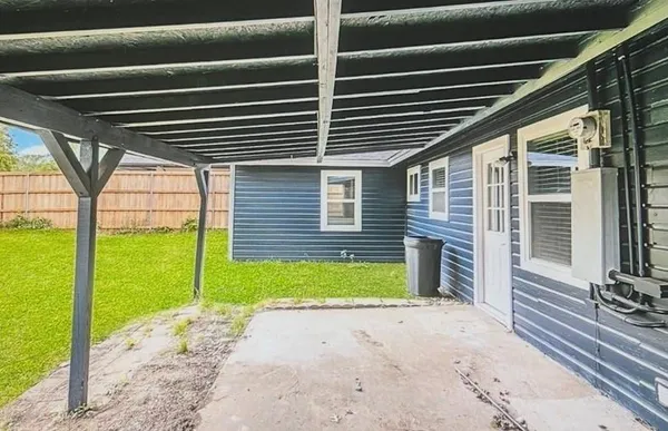 a view of a backyard with a small cabin