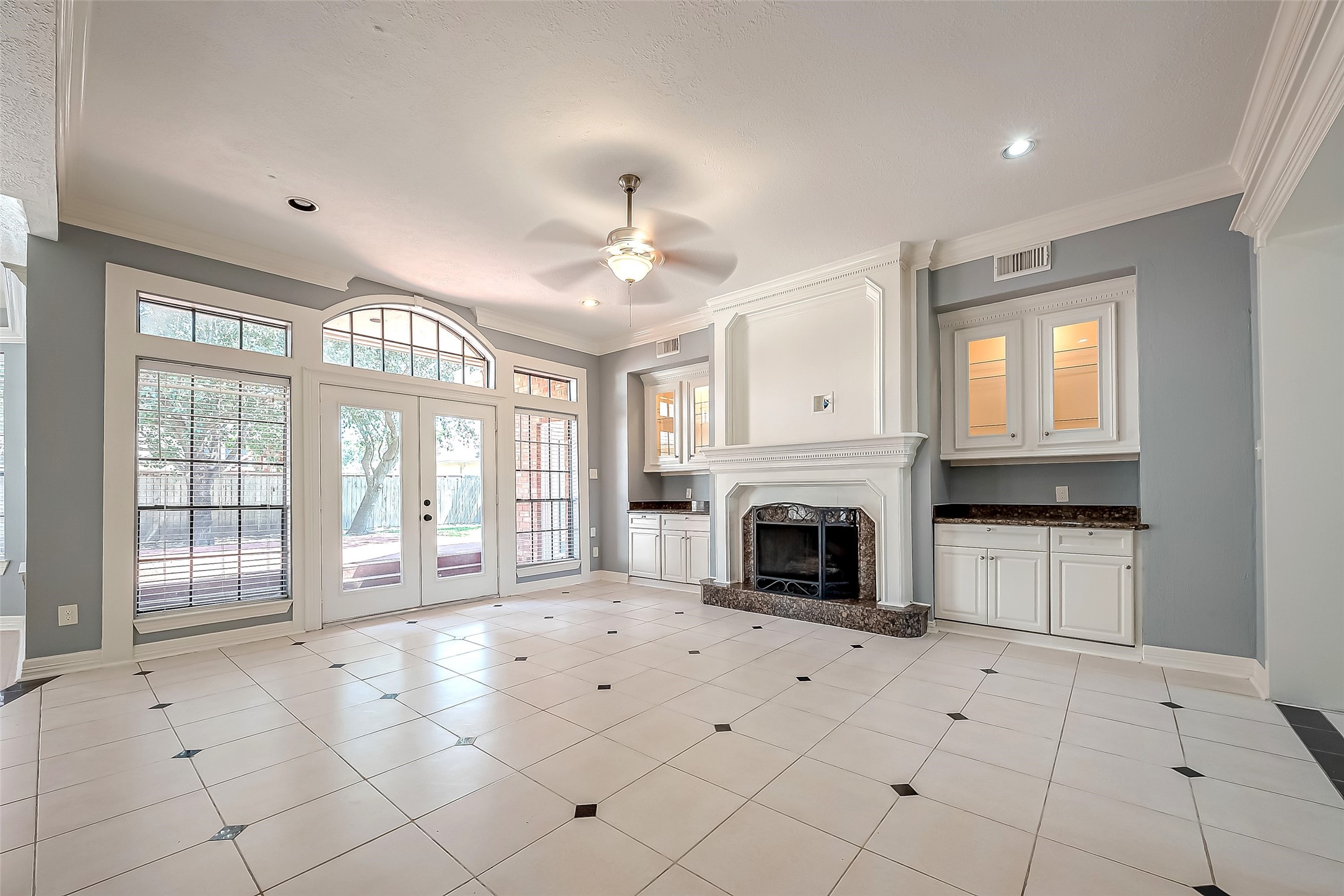 16018 Conners Ace Drive Spring, TX 77379 - Photo 12 of 47 a view of an empty room with a fireplace and a window