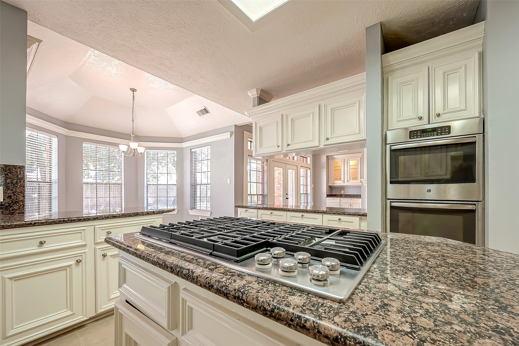 16018 Conners Ace Drive Spring, TX 77379 - Photo 16 of 47 a kitchen with stainless steel appliances granite countertop a stove a sink and a refrigerator
