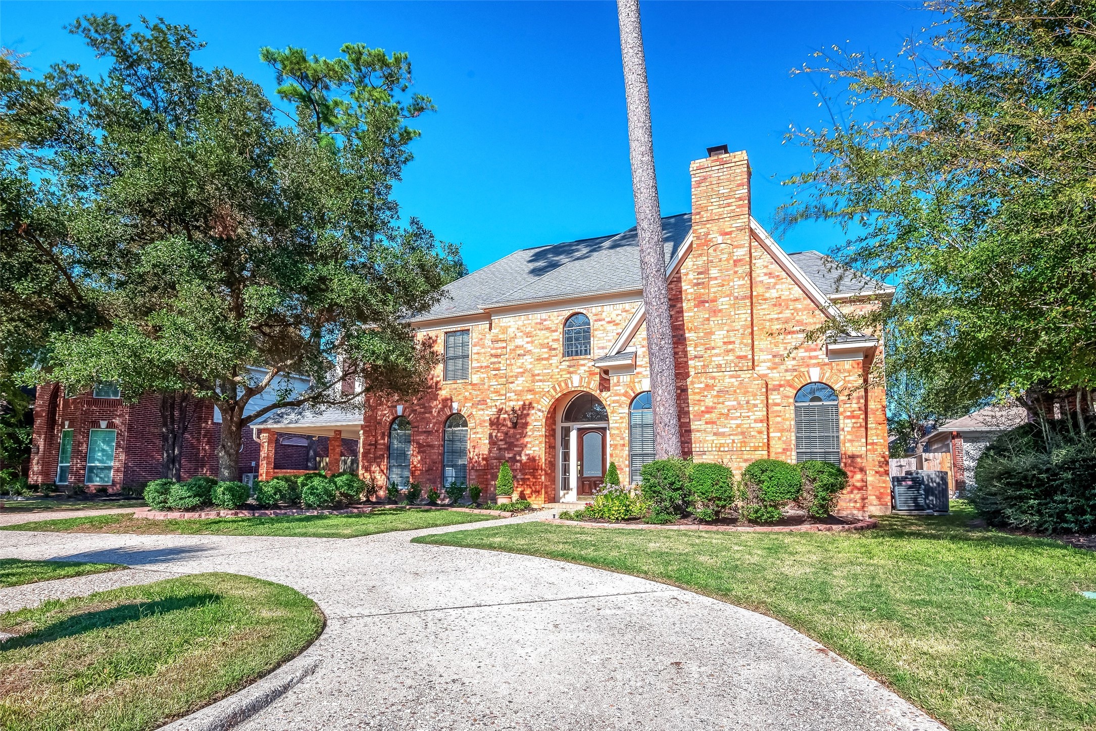 16018 Conners Ace Drive Spring, TX 77379 - Photo 2 of 47 front view of house with a yard and potted plants