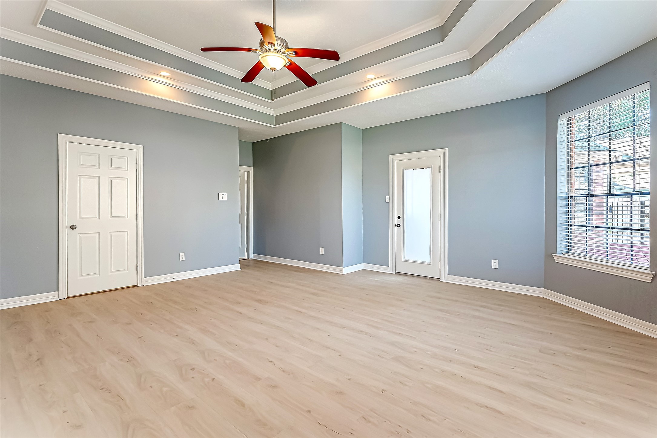 16018 Conners Ace Drive Spring, TX 77379 - Photo 22 of 47 a view of an empty room with window and chandelier fan