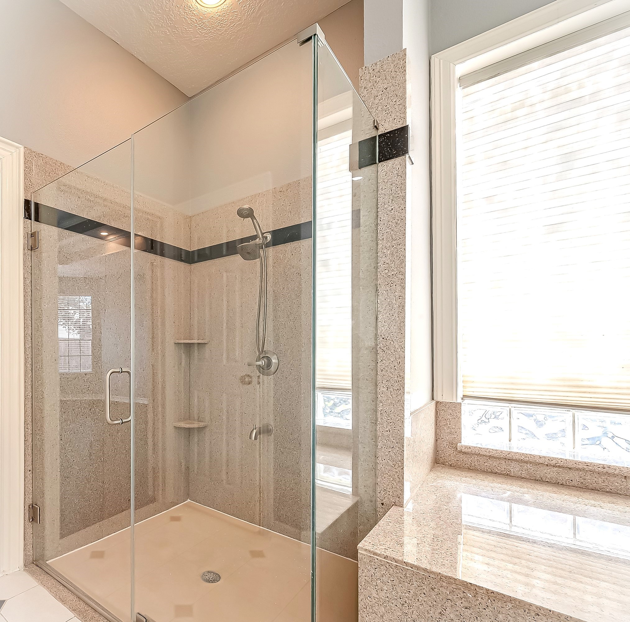 16018 Conners Ace Drive Spring, TX 77379 - Photo 24 of 47 a bathroom with a shower and a bath tub