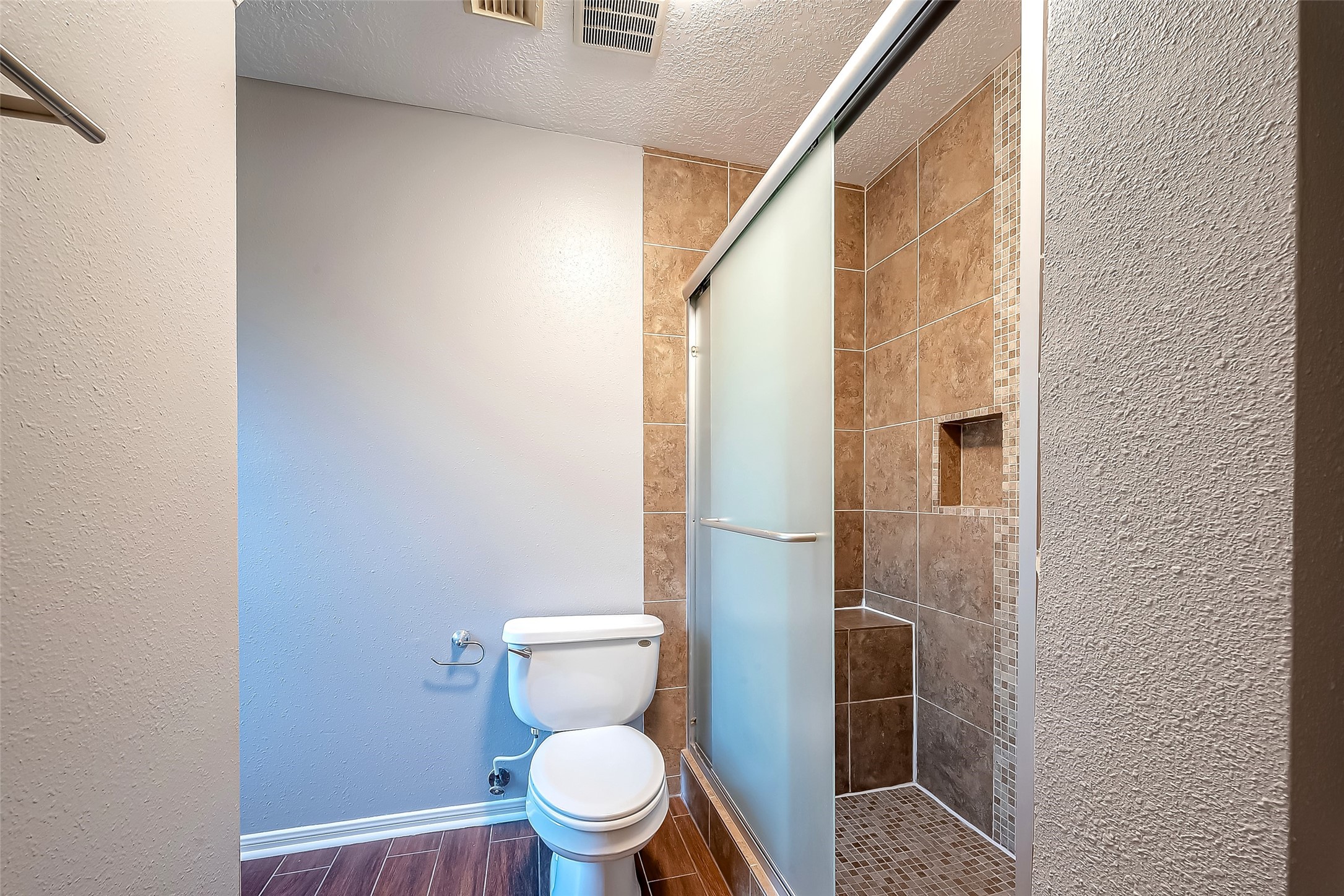 16018 Conners Ace Drive Spring, TX 77379 - Photo 32 of 47 a white toilet sitting next to a small bathroom