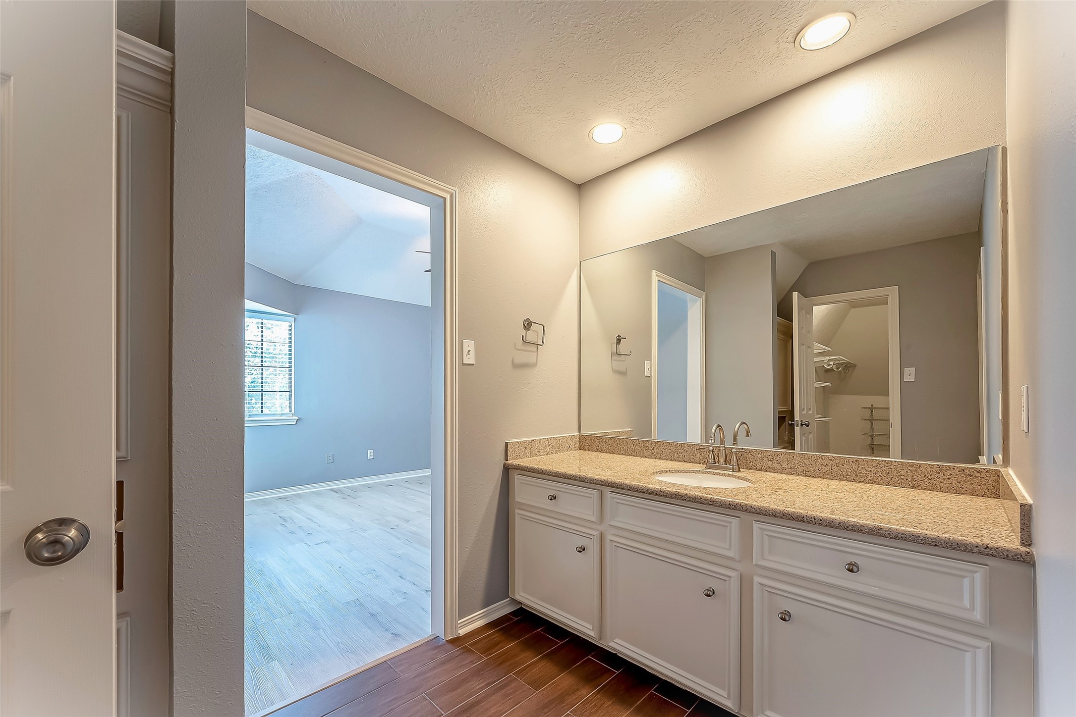 16018 Conners Ace Drive Spring, TX 77379 - Photo 35 of 47 a spacious bathroom with a granite countertop sink mirror and