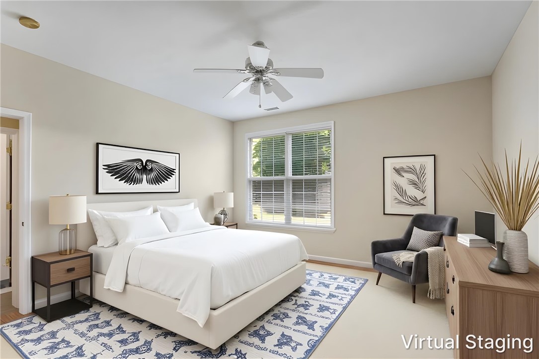155 Life Style Lane Anderson, SC 29621 - Photo 8 of 49 A tranquil bedroom retreat features warm-toned walls, soft flooring, and a large window inviting natural light.