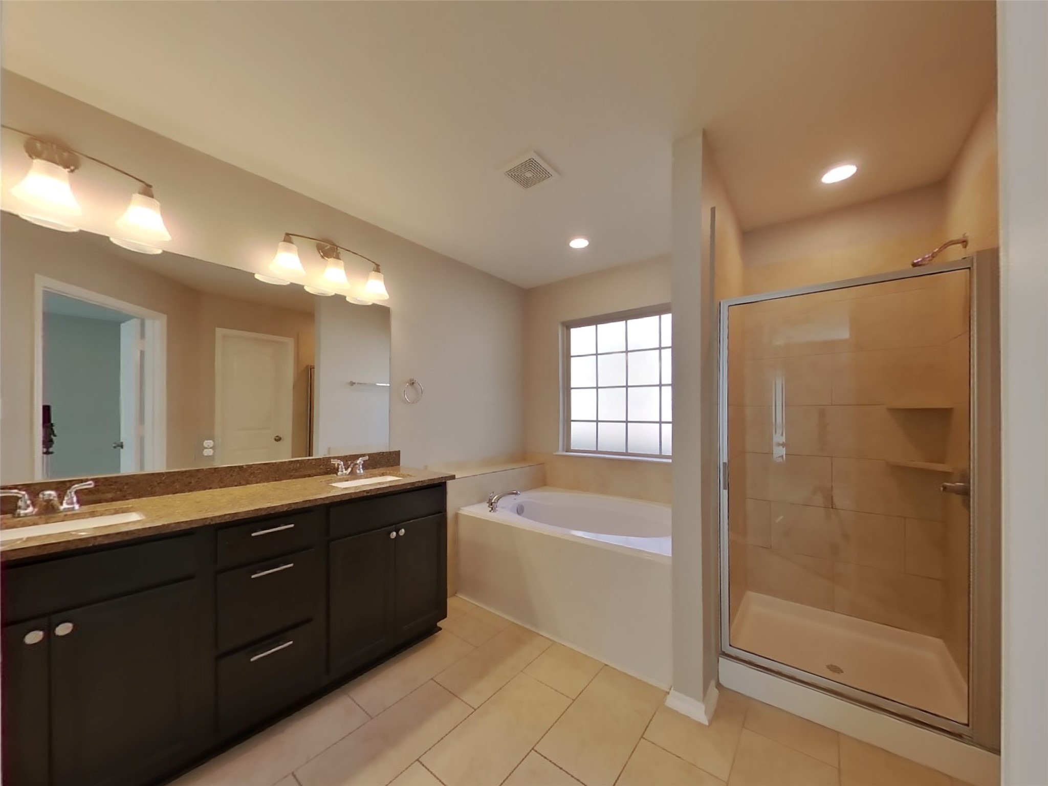 1937 Briar Grove Drive Conroe, TX 77301 - Photo 12 of 18 a spacious bathroom with a tub sink shower and mirror