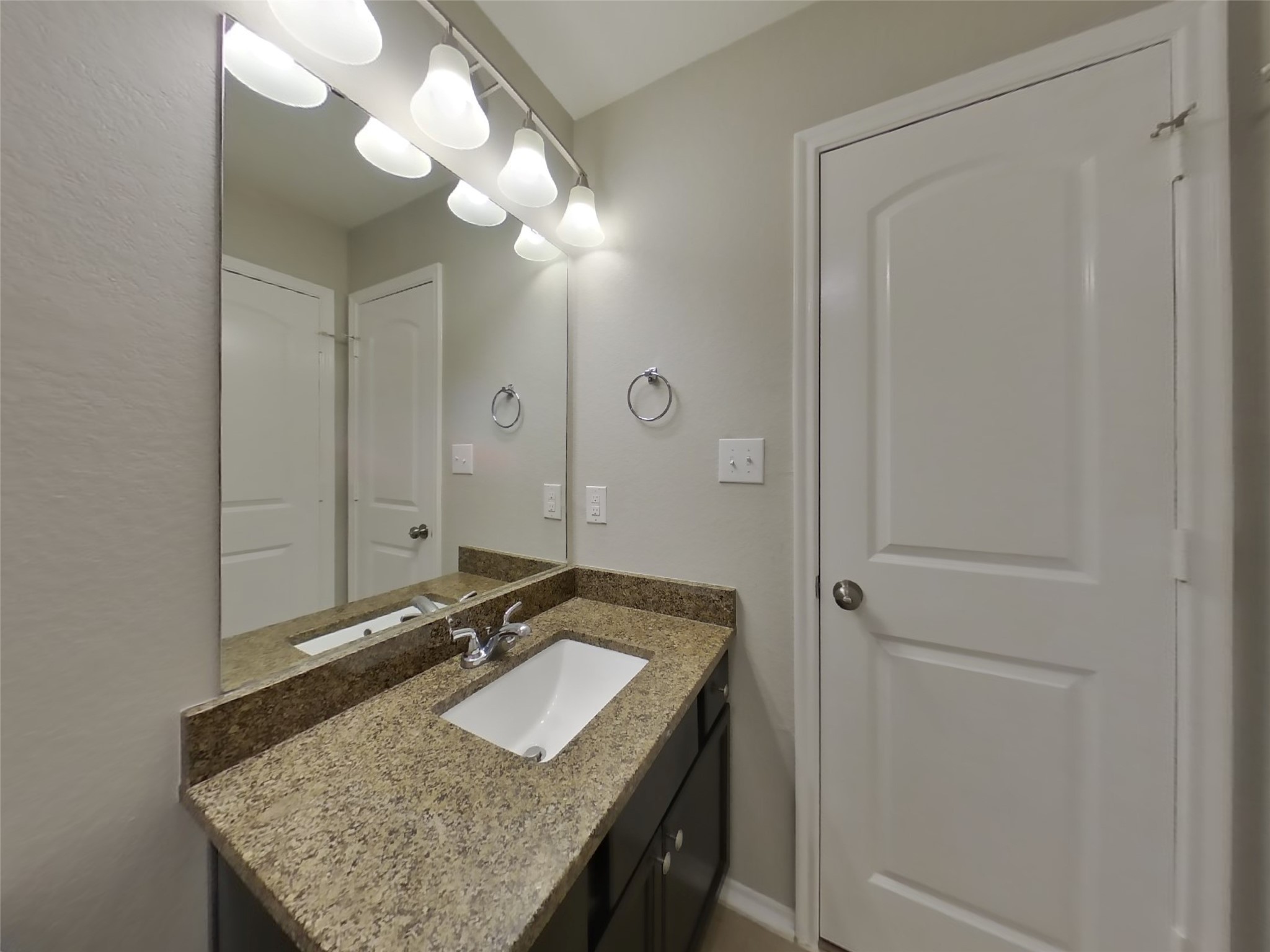 1937 Briar Grove Drive Conroe, TX 77301 - Photo 16 of 18 a bathroom with a granite countertop sink and a mirror