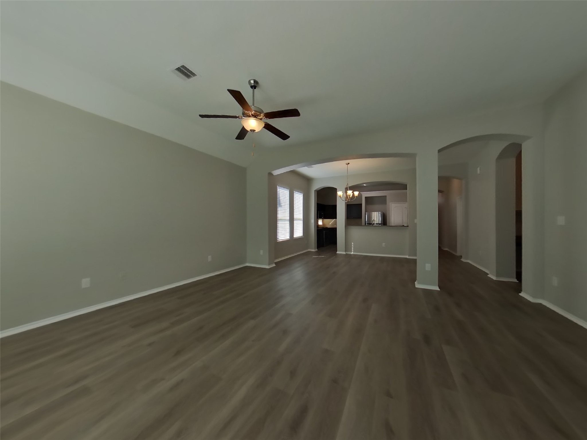 1937 Briar Grove Drive Conroe, TX 77301 - Photo 2 of 18 wooden floor in an empty room with a window