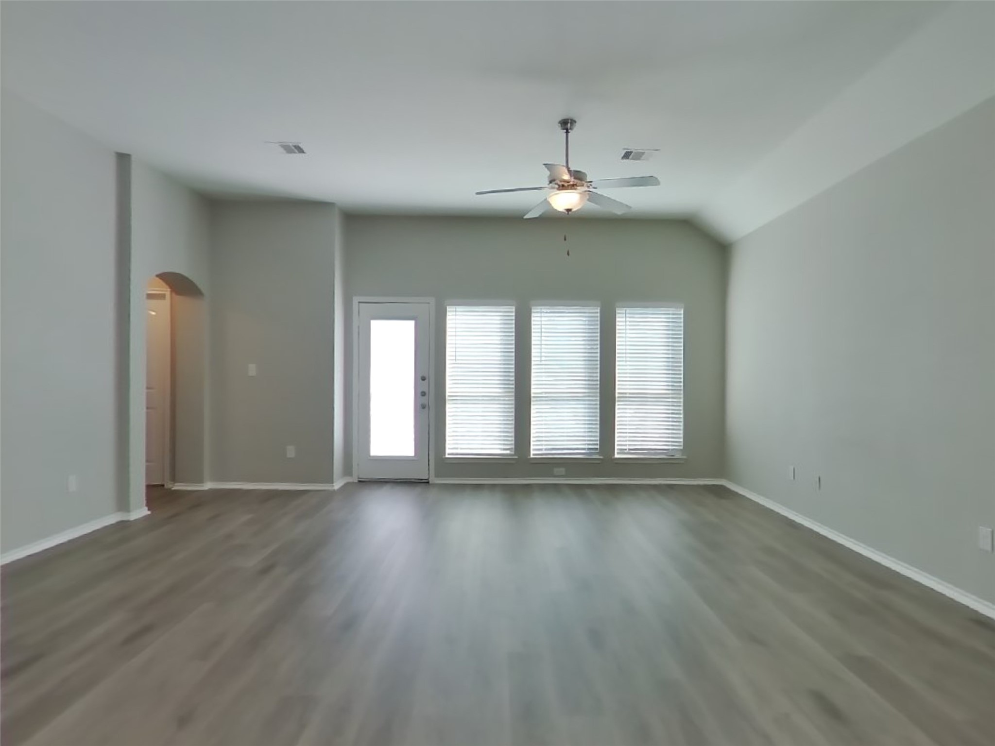 1937 Briar Grove Drive Conroe, TX 77301 - Photo 3 of 18 a view of an empty room with wooden floor and a window